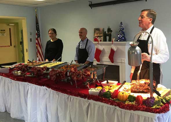 Photo of assisted living foodservice company serving a meal.