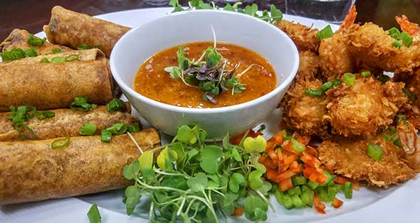 Photo of tempura shrimp and spring rolls.